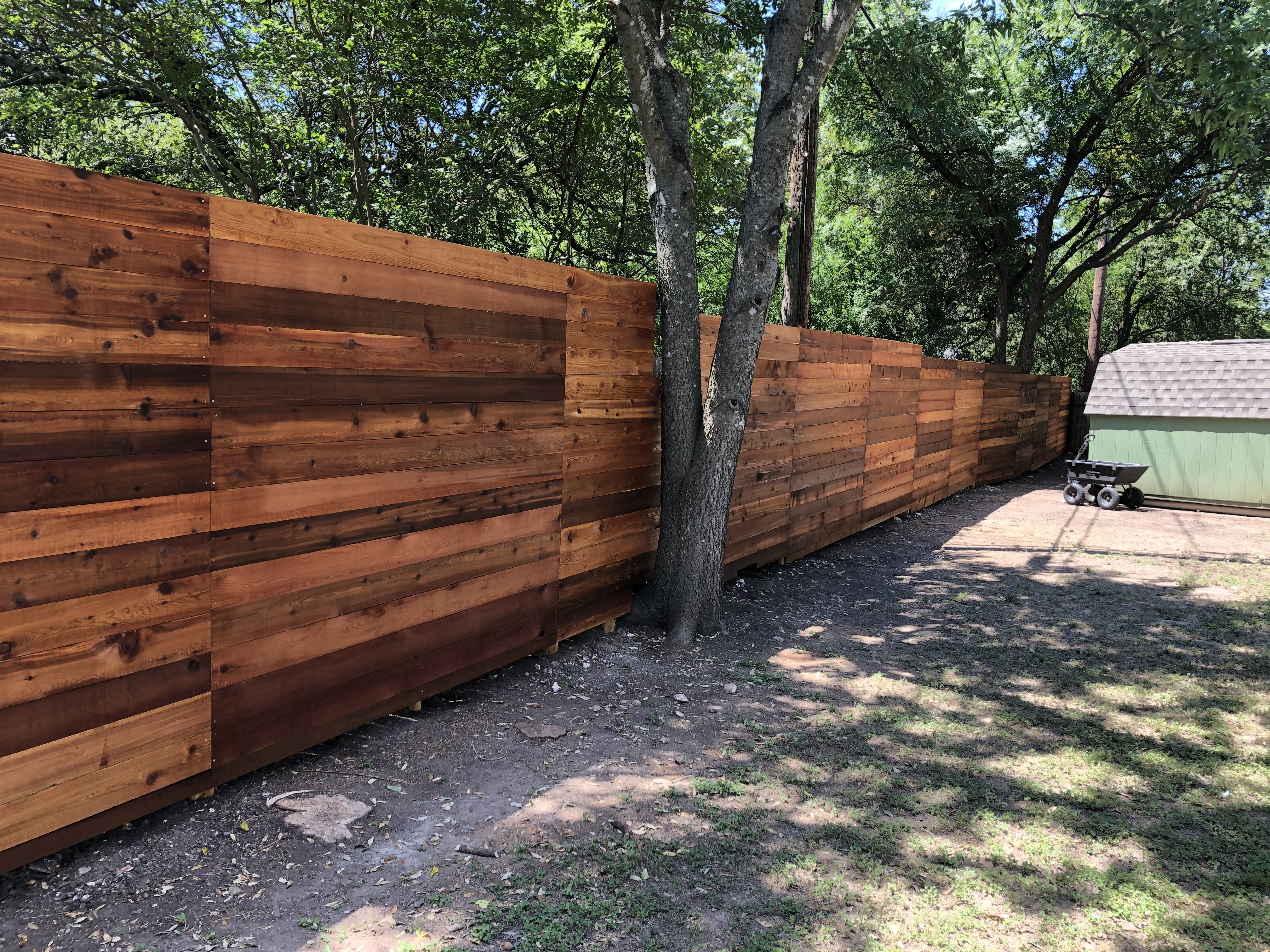 Cedar wood fence installation in Austin, TX by Buda Fence Company