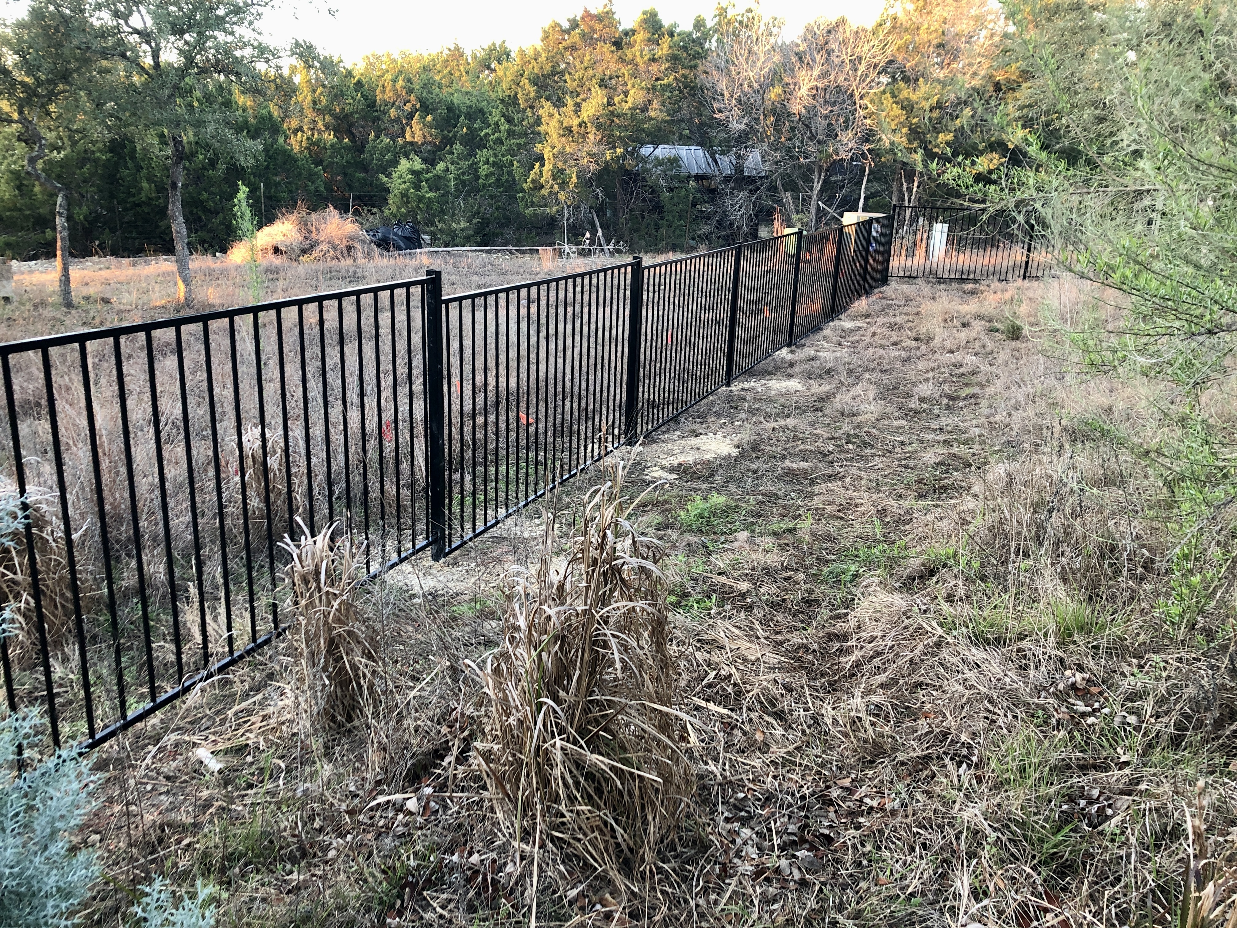 4ft tall black metal fence with wrackable panels in Austin Hill Country