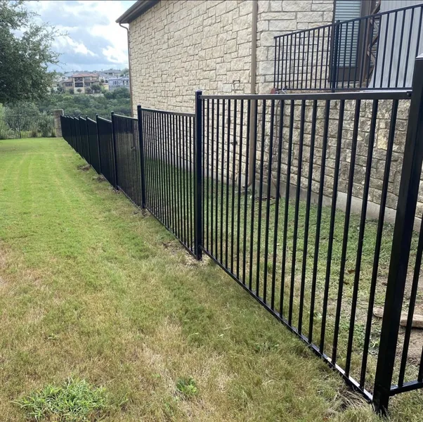 Black metal fence installation Buda TX