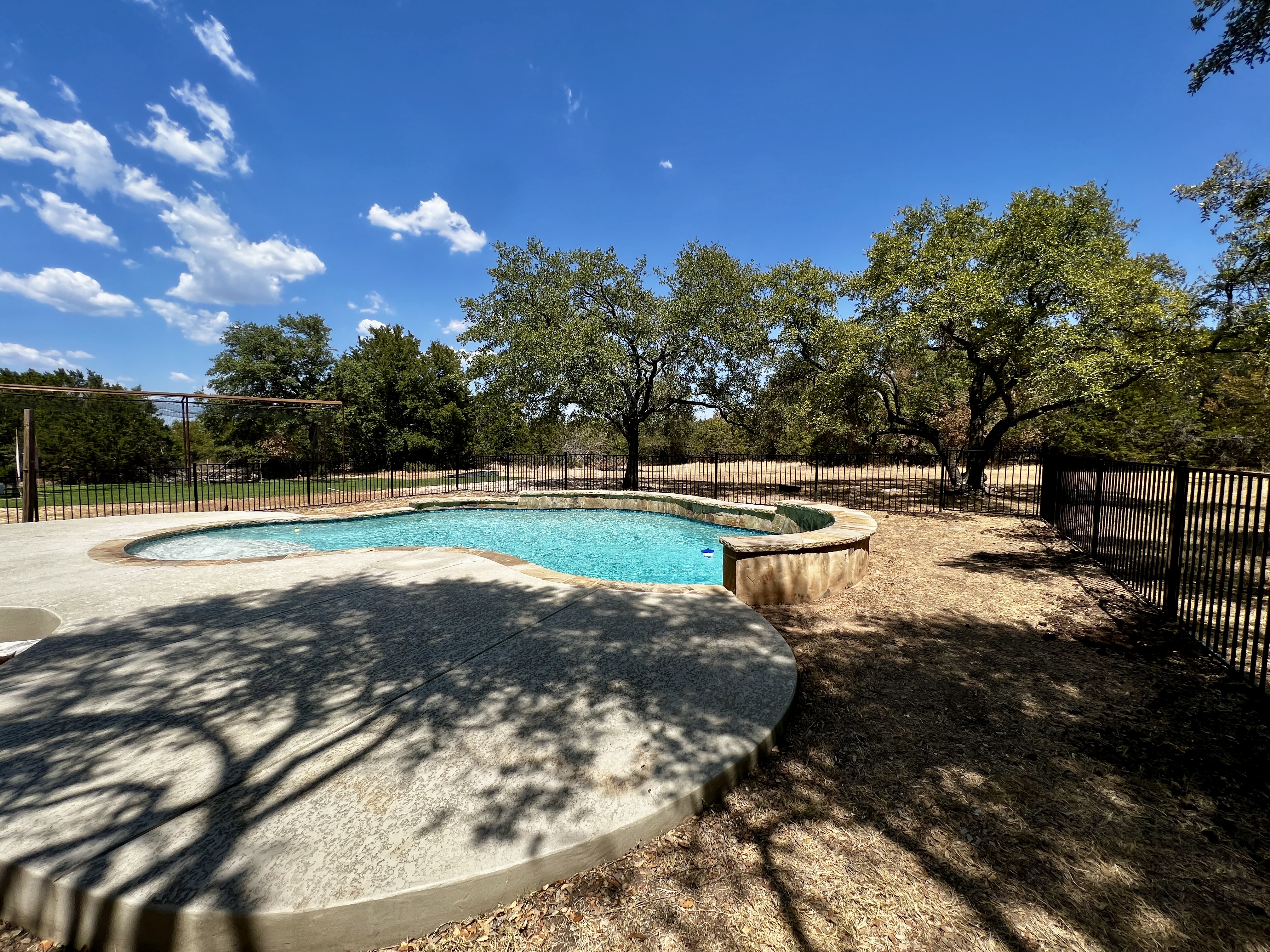 Pool code compliant black metal fence in Austin, TX