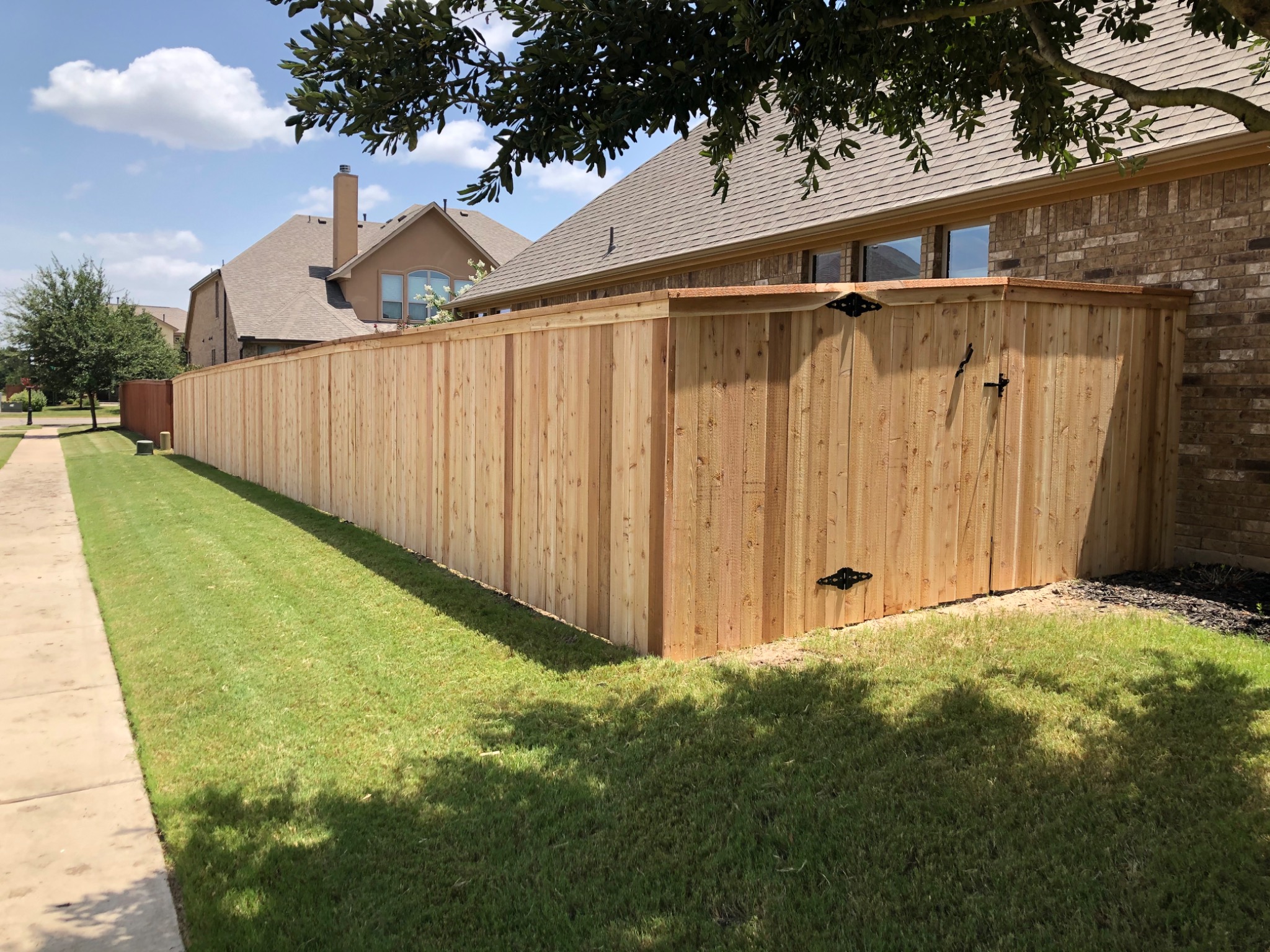 Cedar fence with cap and trim in Austin, TX