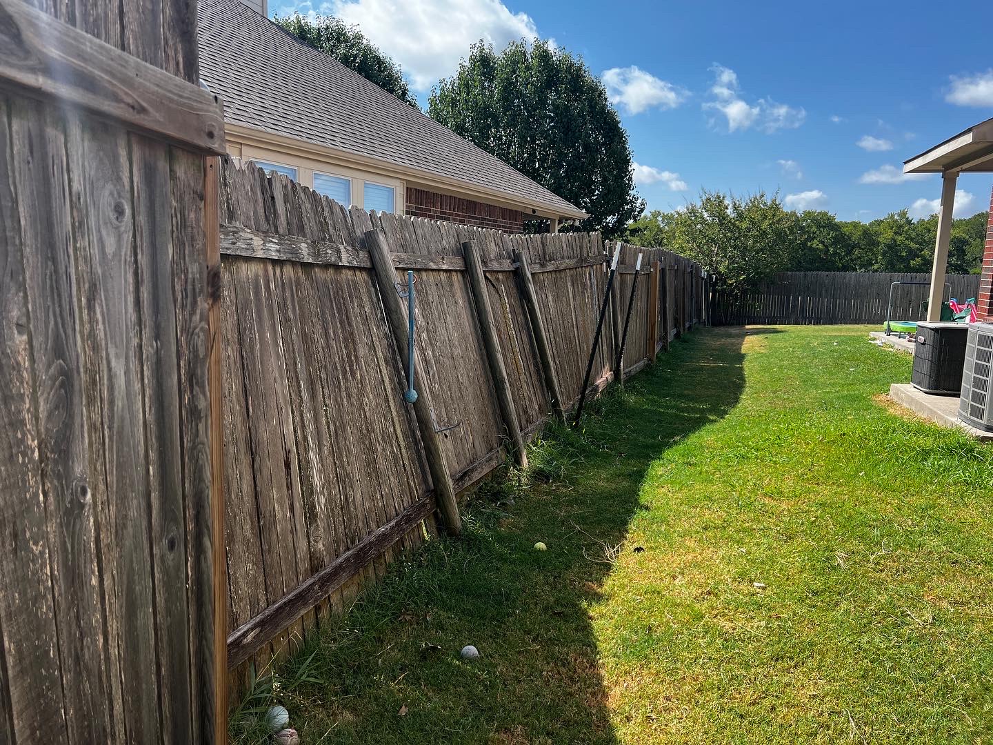 Old deteriorated wood fence before replacement in Austin, TX