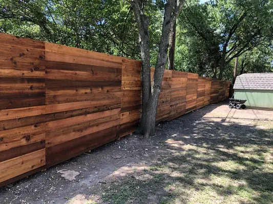 Cedar wood fence installation in Austin, TX by Buda Fence Company