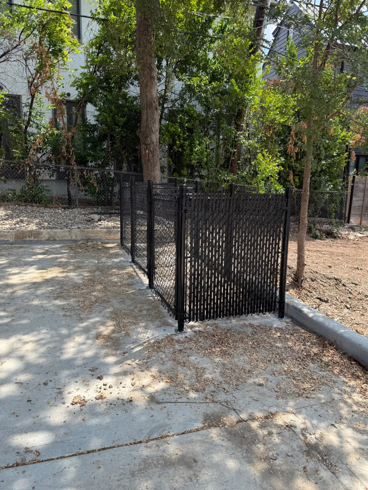 Chain link fence with privacy slats