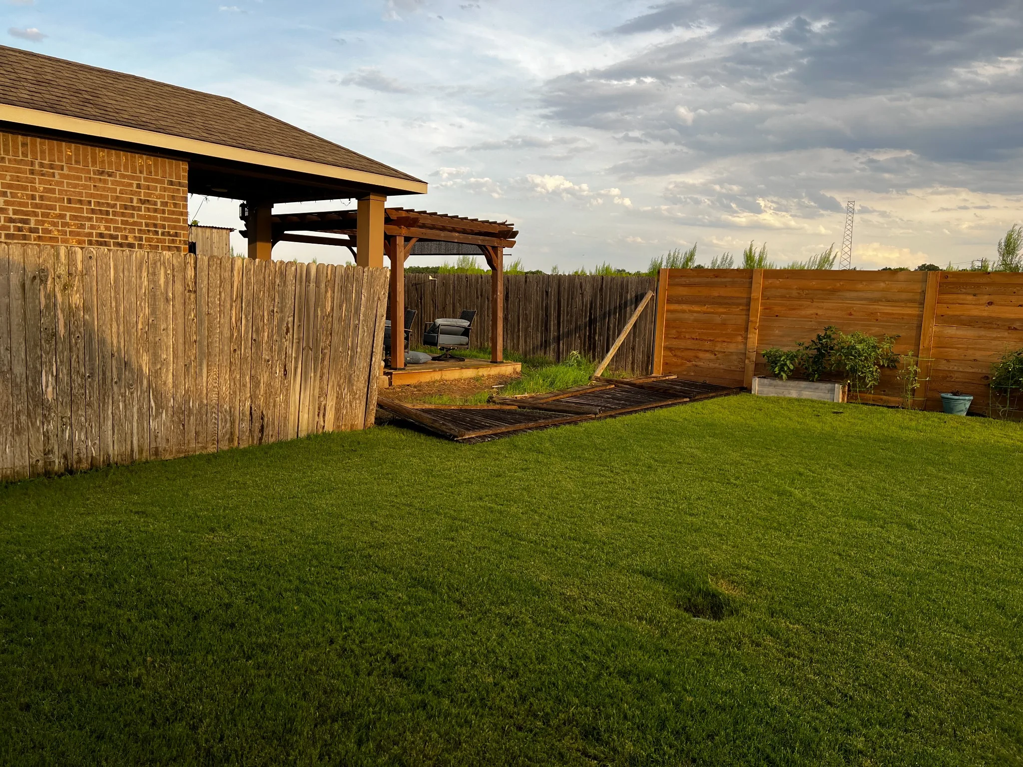 Storm damaged fence blown down requiring emergency repair in Austin, TX