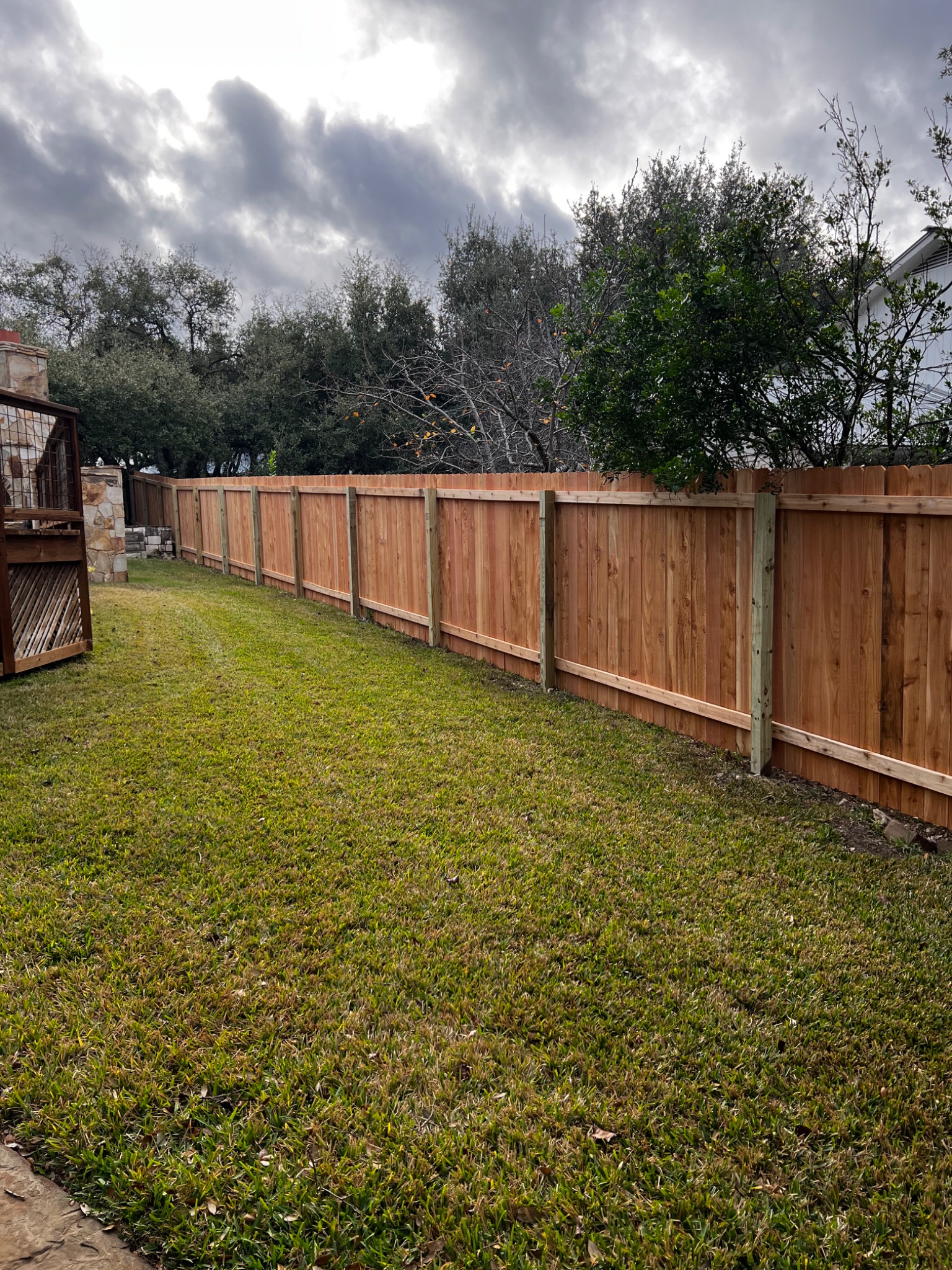 Treated wood fence post installation